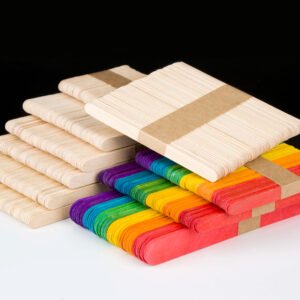 Stacks of natural and vibrant colored wooden ice cream sticks for industrial and craft use